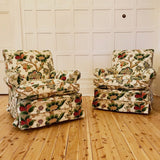 A pair of gorgeous vintage Nina Campbell slip covered armchairs